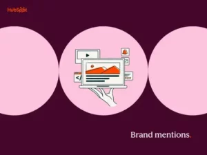 a hubspot-branded featured image with a dark burgundy background and three pink shapes in the foreground, with the words “brand mentions” in the bottom righthand corner and a pictogram of a hand holding a laptop in the center
